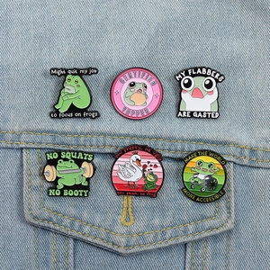 Funny 6-piece cartoon frog enamel pin set on denim background for bags and clothes