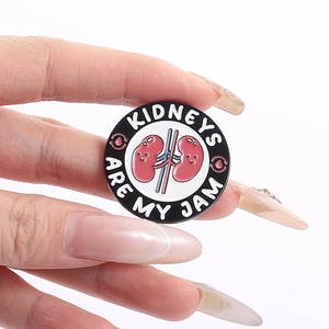 Funny pink kidney enamel pin with Kidneys Are My Jam text on black background
