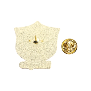 Detailed back view of a golden metal pin with matte texture and butterfly clasp closure