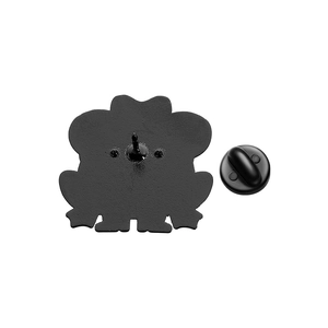 Detail view of the black enamel frog pin back showing pin and rubber clutch