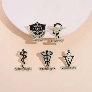 Five gold vintage medical brooches with black enamel profession symbols on pink background