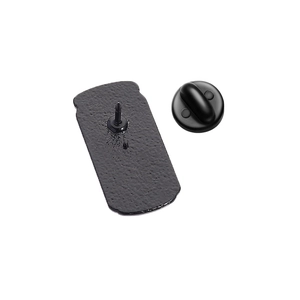 Detailed back view of metal beverage pin showing matte texture and black rubber clutch