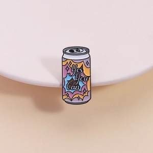 Cartoon enamel badge featuring a soda can shape and the inspirational Yes You Can slogan