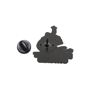 Detail of matte black metal pin base and secure rubber clutch backing for cartoon brooches