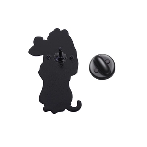 Detail view of the black metal brooch back with secure pin and rubber butterfly clasp