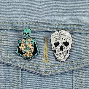 Detail of creative cat skull enamel pins on denim jacket showing vibrant colors