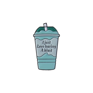Enamel pin badge featuring a mint green beverage cup with 'I just Love having A blast' text