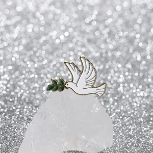 Exquisite white peace dove enamel pin with golden outlines and green olive branch