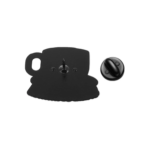 Detail view of the black rubber clutch and metal pin back of a coffee cup enamel badge