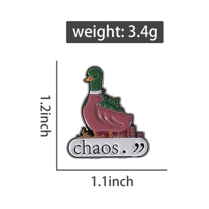 Detail of green mallard enamel pin with chaos text showing 3.4g weight and dimensions