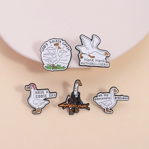 Set of five funny goose enamel pins with humorous slogans on white pedestals