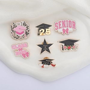 7-piece 2025 Graduation enamel pin set with star and cap designs on white display