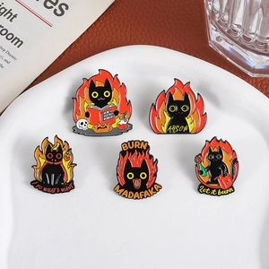 Set of 5 black cat enamel pins featuring fire and book motifs with chaotic aesthetic style