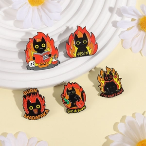 Funny black cat enamel pins set featuring fire designs and humorous texts on display stand