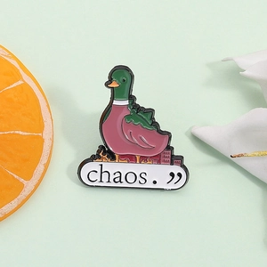 Creative cartoon duck enamel pin featuring a burning city silhouette and Chaos text