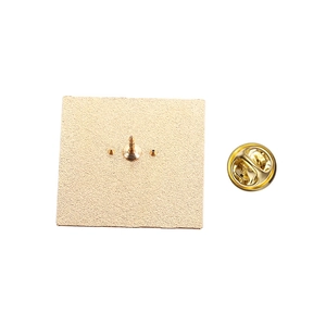 Detailed back view of a gold-tone cat brooch featuring a secure butterfly clutch fastener