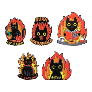 Set of five creative black cat enamel pins featuring funny cartoon fire and reading themes