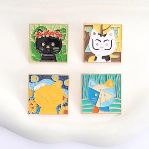 Macro detail of four artistic square enamel pins featuring famous artist cat portraits