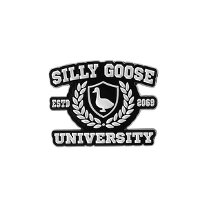 Macro detail of Silly Goose University enamel pin with classic black and white crest