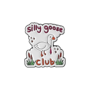 Detailed view of enamel pin featuring a white goose with tie and silly goose CLUB text