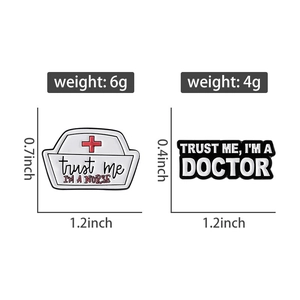 Detailed view of metal enamel nurse and doctor pins with Trust Me lettering and dimensions