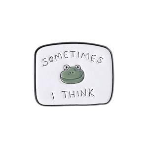 Detail of a white rectangular enamel pin featuring a green frog and Sometimes I Think text