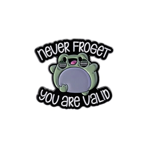 Detail of cartoon frog enamel pin featuring 'never FROGET' and 'you are VALID' text