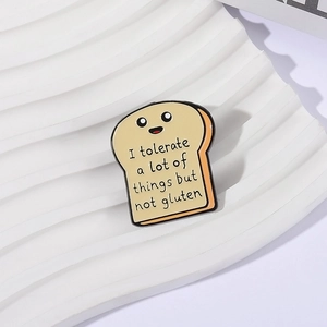 Cute cartoon toast enamel pin with humor quote on a clean white textured background