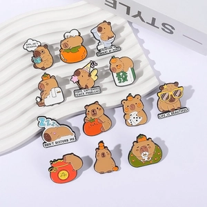 Collection of 13 cute cartoon capybara enamel pins with colorful lacquer finishes