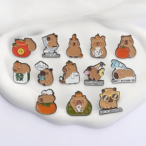 Set of 13 cute Capybara enamel pins featuring oranges and mahjong on a stone tray