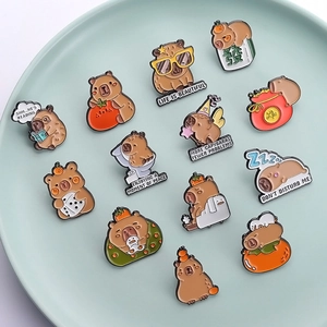 Set of 12 cute cartoon capybara enamel pins with creative animal designs and funny poses