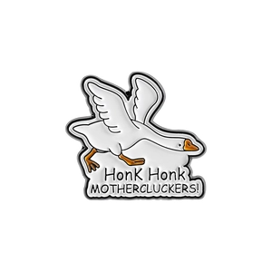 Close-up of duck enamel pin featuring Honk Honk Mothercluckers text in silver metal finish