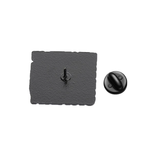 Detailed back view of enamel pin with sandblast texture and black rubber clutch backing