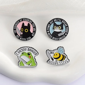 Set of creative enamel pins featuring animals like black cat and bee with funny slogans