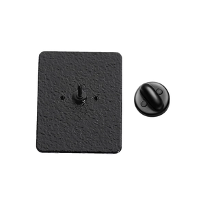 Detail view of the black rectangle enamel pin back with textured surface and clutch backing