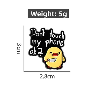 Cartoon yellow duck enamel pin with knife and Don't touch my phone ok text