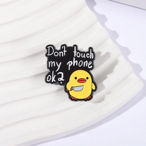 Cartoon yellow duck holding a knife enamel pin with Don't touch my phone ok text