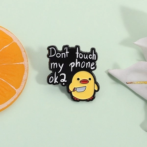 Funny yellow duck enamel pin with 'Don't touch my phone ok?' lettering for clothing