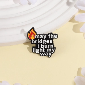 Flame badge enamel pin with inspirational quote May the bridges I burn light my way