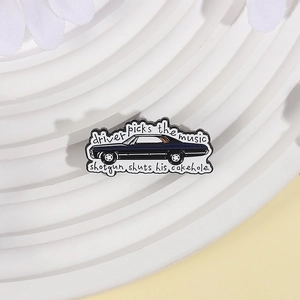 Detail of Supernatural enamel pin with 1967 Impala car and iconic driver quote