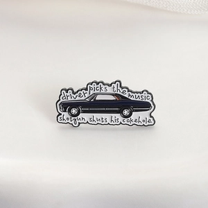 Supernatural inspired black classic car enamel pin with white quote lettering details