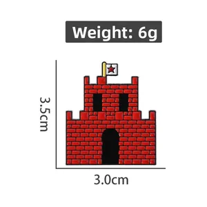 Detail view of red castle enamel brooch showing 3.5cm dimensions and 6g weight details