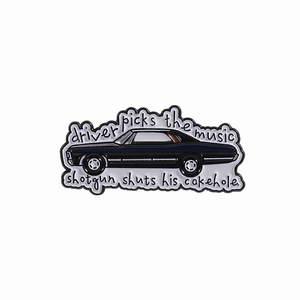 Black vintage car enamel pin featuring Supernatural quote Driver picks the music