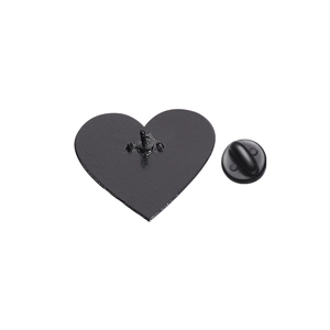 Detailed back view of heart enamel pin with black rubber clutch on white background
