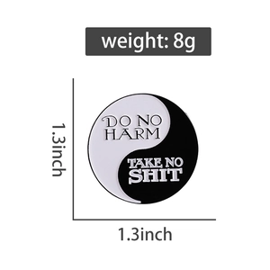 Macro view of 1.3-inch Tai Chi enamel pin showing weight and dimensions in detail