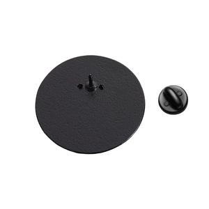Detail view of the black matte metal brooch back with rubber butterfly clutch closure