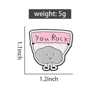 Detailed dimensions of cartoon stone enamel pin with You Rock banner at 5g weight