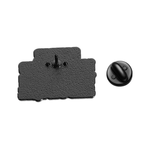 Detail of matte black enamel pin back and rubber clutch on a clean white background