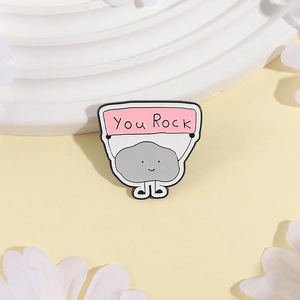 Cartoon dark cloud rock alloy brooch badge with You Rock text design on white podium