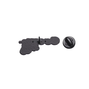 Detailed macro view of matte black brooch pin back with secure rubber fastener and metal base